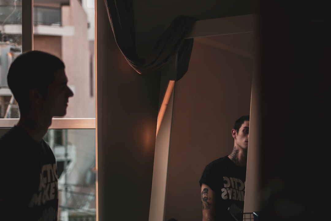 man practicing speech in mirror