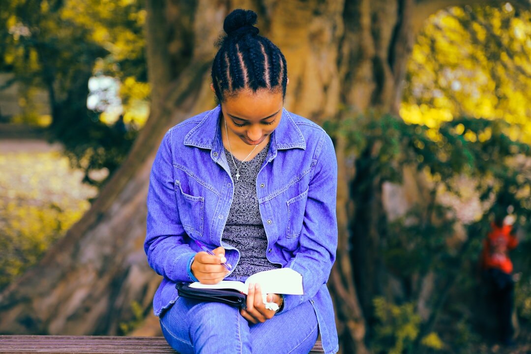 woman writing goals